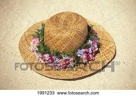 Stock Image - Straw Hat With Flower Rim. Fotosearch