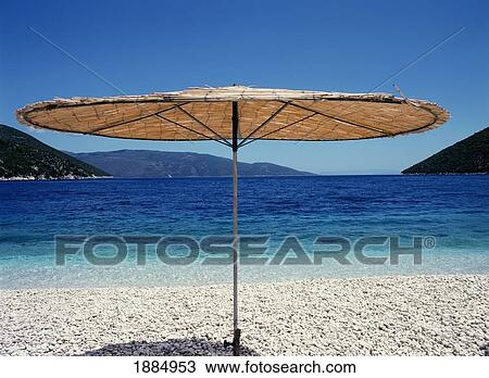 Straw Umbrella On White Pebbled Beach View Large Photo Image Stock Image - Straw Umbrella On White Pebbled Beach. Fotosearch