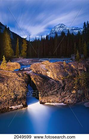 Stock Photo - Stream And Mount Stephen At Dusk, Yoho National Park, British Columbia. Fotosearch