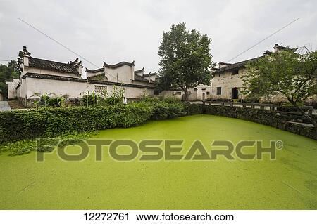Stock Image - Stream-side villa, Xidi, Anhui, China. Fotosearch