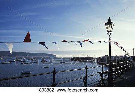 Streamers Blowing On Victorian Pier At Swanage View Large Photo Image Stock Image - Streamers Blowing On Victorian Pier At Swanage. Fotosearch