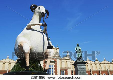 Stock Photograph - Street art in Rynek Glowny of Krakow in front of old cloth guild; Krakow, Poland. Fotosearch