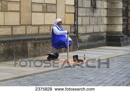 Street artist levitating, Dresden, Saxony, Germany View Large Photo Image Stock Photo - Street artist levitating, Dresden, Saxony, Germany. Fotosearch