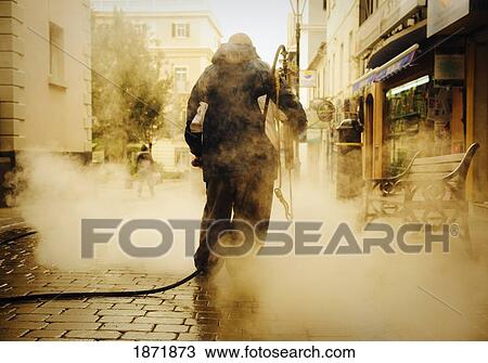 Stock Image - Street Cleaner Working On A Main Street; Gibraltar. Fotosearch