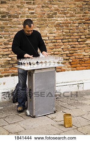 Picture - Street Performer Arranging Wineglasses; Venice, Italy. Fotosearch