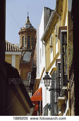 Stock Photography - Street Scene Of Iglesia De Santa Cruz In Seville. Fotosearch