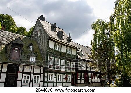 Stock Image - Street Scene With Half-Timbered Buildings, Goslar, Germany. Fotosearch