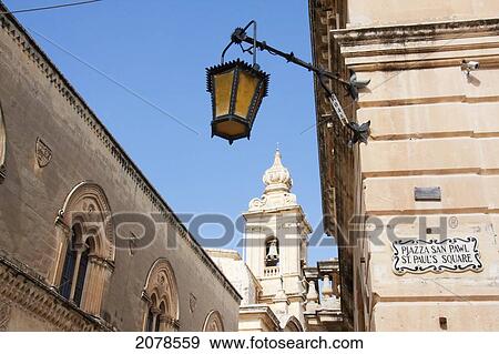 Stock Photo - Street Scene With The Bell Tower Of The Carmelite Church, Mdina, Malta. Fotosearch