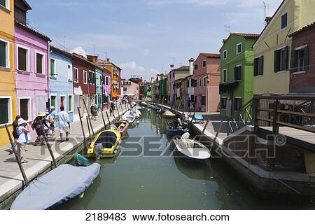 Stock Image - Street Scenes Of Colorful Homes Along The Canal In Burano, A Small Island Off Venice, Italy. Fotosearch