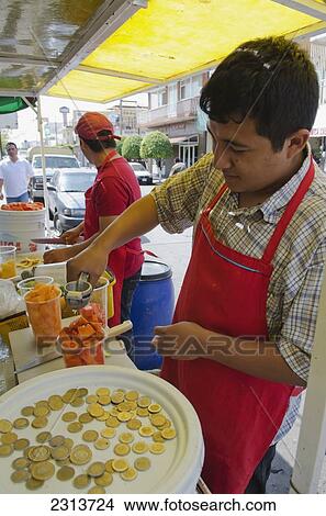 Street side vendor preparing fruit cup; Aguascalientes, Aguascalientes state, Mexico View Large Photo Image Picture - Street side vendor preparing fruit cup; Aguascalientes, Aguascalientes state, Mexico. Fotosearch