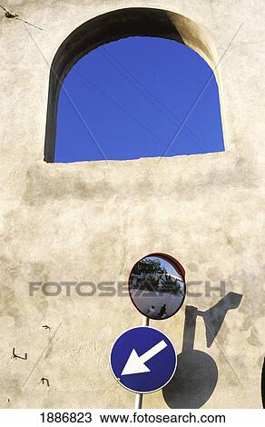Stock Image - Street Sign And Mirror In Front Of Wall. Fotosearch