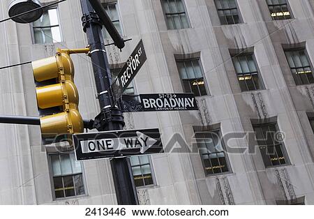 Stock Photograph - Street sign and traffic light on Broadway; New York City, New York, United States of America. Fotosearch