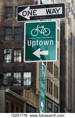 Stock Photograph - Street signs for traffic and destinations; New York City, New York, United States of America. Fotosearch