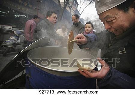 Street Stall Selling Food In The Muslim Quarter, Xian, Xi'an, Capital Of Shaanxi Province, China View Large Photo Image Stock Image - Street Stall Selling Food In The Muslim Quarter, Xian, Xi'an, Capital Of Shaanxi Province, China. Fotosearch
