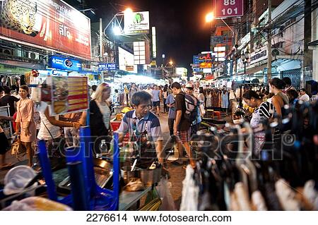 Picture - Street traders, locals and tourists mingle along the Khao San Road at night; Bangkok, Thailand. Fotosearch