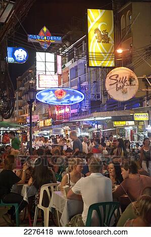 Street traders, locals and tourists mingle along the Khao San Road at night; Bangkok, Thailand View Large Photo Image Stock Photo - Street traders, locals and tourists mingle along the Khao San Road at night; Bangkok, Thailand. Fotosearch