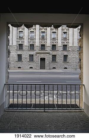 Stock Image - Street Viewed Through Archway. Fotosearch