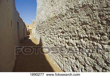 Stock Photo - Street With Brick Wall In Old Abandoned City Ghadames. Fotosearch