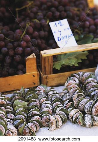 Stock Photo - Strings Of Dried Figs And Grapes For Sale In Market In Dubrovnik, Croatia.. Fotosearch