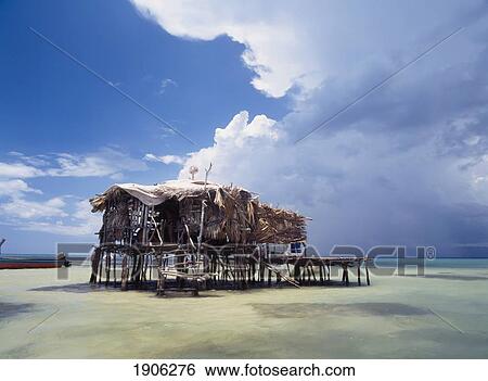 Stock Photograph - Strom Clouds Over Ffloyds Bar Near Treasure Beach, Jamaica.. Fotosearch