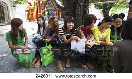Stock Image - Students at Kuthodaw Paya; Mandalay, Burma. Fotosearch