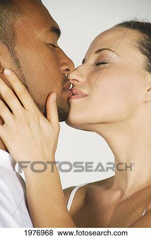 Studio Image Of Couple Kissing. View Large Photo Image Stock Photo - Studio Image Of Couple Kissing.. Fotosearch