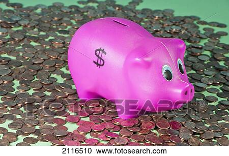 Stock Image - Studio shot of a childs piggy bank surrounded by pennies.. Fotosearch