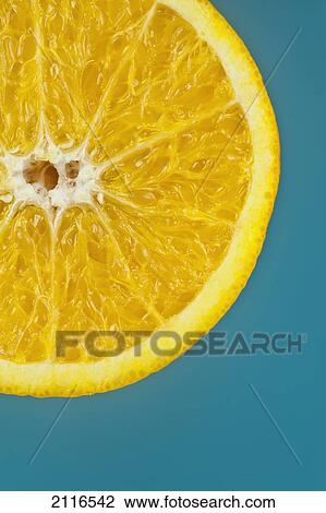 Studio shot of an orange half on a blue background. View Large Photo Image Stock Image - Studio shot of an orange half on a blue background.. Fotosearch
