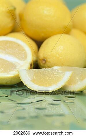 Studio Shot Of Lemon Slices And Whole Lemons, Soft Focus, Water Drops View Large Photo Image Stock Photograph - Studio Shot Of Lemon Slices And Whole Lemons, Soft Focus, Water Drops. Fotosearch