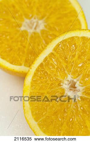Stock Photography - Studio shot of two orange halves.. Fotosearch