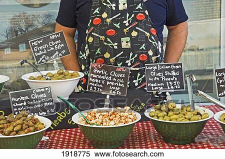 Stock Photography - Stuffed Olives And Marinated Garlic Cloves At A Farmer's Market Stall In Tunbridge Wells, Kent, England, United Kingdom. Fotosearch