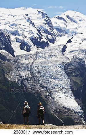 Stock Photo - Summer hiking above Chamonix-Mont Blanc valley, with Mont Blanc mountain in background; France. Fotosearch