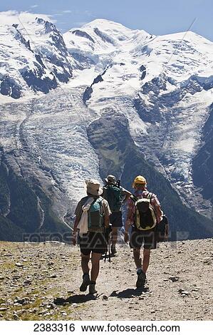 Stock Photograph - Summer hiking above Chamonix-Mont Blanc valley, with Mont Blanc mountain in background; France. Fotosearch