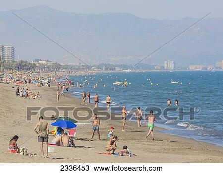 Summer Scene On The Playamar Bajondillo Beach; Torremolinos, Malaga Province, Costa Del Sol, Spain View Large Photo Image Stock Image - Summer Scene On The Playamar Bajondillo Beach; Torremolinos, Malaga Province, Costa Del Sol, Spain. Fotosearch