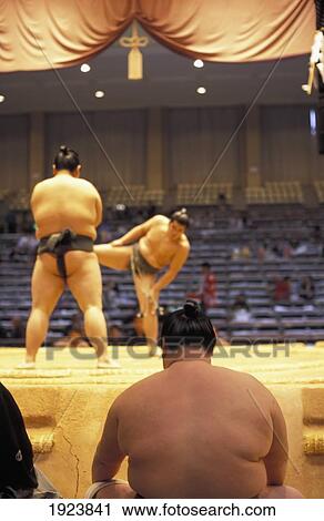 Stock Image - Sumo Wrestler Sitting Prior To His Fight At One Of The Six Major Tournaments. Fotosearch