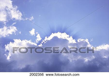 Sun Rays Peeking Out From Clouds, Blue Sky View Large Photo Image Stock Photograph - Sun Rays Peeking Out From Clouds, Blue Sky. Fotosearch