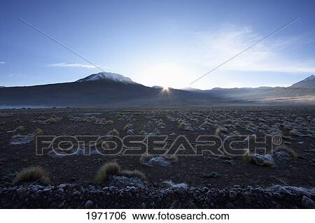 Sun Rising Over The El Tatio Geysers Covered By Fog At Dawn, Antofagasta Region, Chile View Large Photo Image Stock Photograph - Sun Rising Over The El Tatio Geysers Covered By Fog At Dawn, Antofagasta Region, Chile. Fotosearch