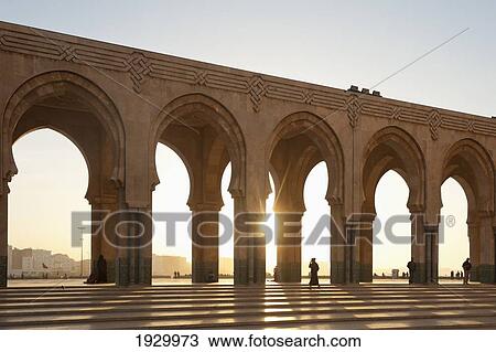 Sun setting behind arcade of Hassan II Mosque; Casablanca, Morocco View Large Photo Image Stock Image - Sun setting behind arcade of Hassan II Mosque; Casablanca, Morocco. Fotosearch