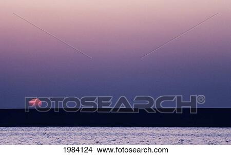 Sun Setting Over Lake, Purple Haze. View Large Photo Image Picture - Sun Setting Over Lake, Purple Haze.. Fotosearch