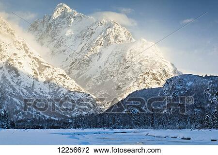 Sun shining on Mt. Yukla with frozen Eagle River in the foreground, Chugach Mountains, Chugach State Park, Southcentral Alaska, Winter View Large Photo Image Stock Image - Sun shining on Mt. Yukla with frozen Eagle River in the foreground, Chugach Mountains, Chugach State Park, Southcentral Alaska, Winter. Fotosearch