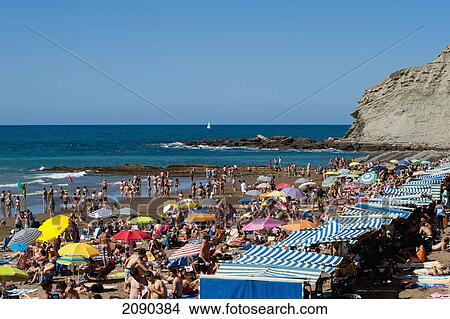Sunbathing At Itzurun Beach, Zumaia, Basque Country, Spain View Large Photo Image Picture - Sunbathing At Itzurun Beach, Zumaia, Basque Country, Spain. Fotosearch