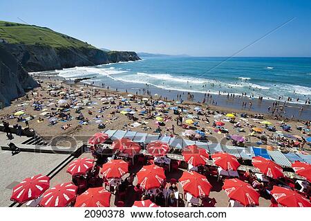 Stock Photo - Sunbathing At Itzurun Beach, Zumaia, Basque Country, Spain. Fotosearch