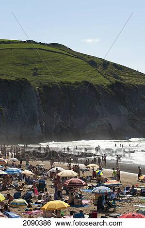 Sunbathing At Itzurun Beach, Zumaia, Basque Country, Spain View Large Photo Image Stock Photograph - Sunbathing At Itzurun Beach, Zumaia, Basque Country, Spain. Fotosearch