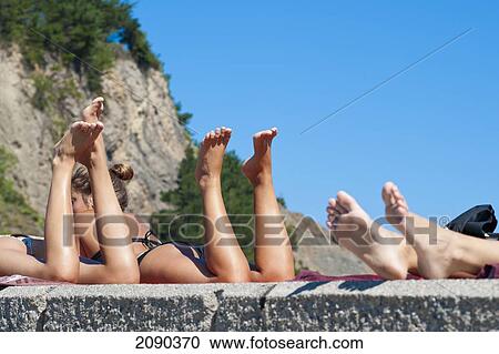 Sunbathing In The Cantabrian Coast, Mutriku, Basque Country, Spain View Large Photo Image Stock Image - Sunbathing In The Cantabrian Coast, Mutriku, Basque Country, Spain. Fotosearch