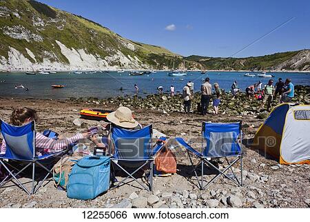 Sunbathing, Lulworth cove; Dorset, England View Large Photo Image Stock Photograph - Sunbathing, Lulworth cove; Dorset, England. Fotosearch