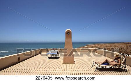 Sunbathing on a rooftop; Morocco View Large Photo Image Stock Photography - Sunbathing on a rooftop; Morocco. Fotosearch
