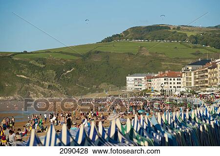 Stock Photo - Sunbathing On The Beach, Zarautz, Basque Country, Spain. Fotosearch
