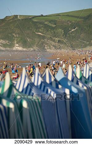 Stock Photo - Sunbathing On The Beach, Zarautz, Basque Country, Spain. Fotosearch