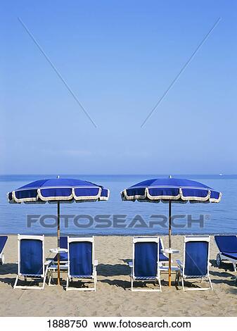 Sunchairs And Umbrellas On Beach View Large Photo Image Stock Image - Sunchairs And Umbrellas On Beach. Fotosearch