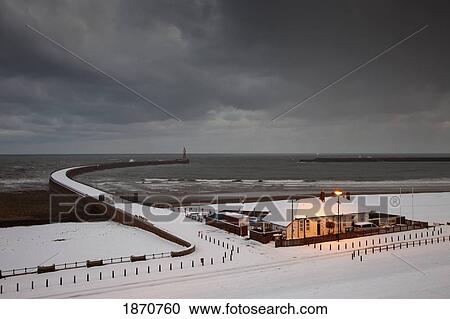Stock Image - Sunderland, Tyne And Wear, England; A Stormy Sky Above A Building Along The Coast. Fotosearch